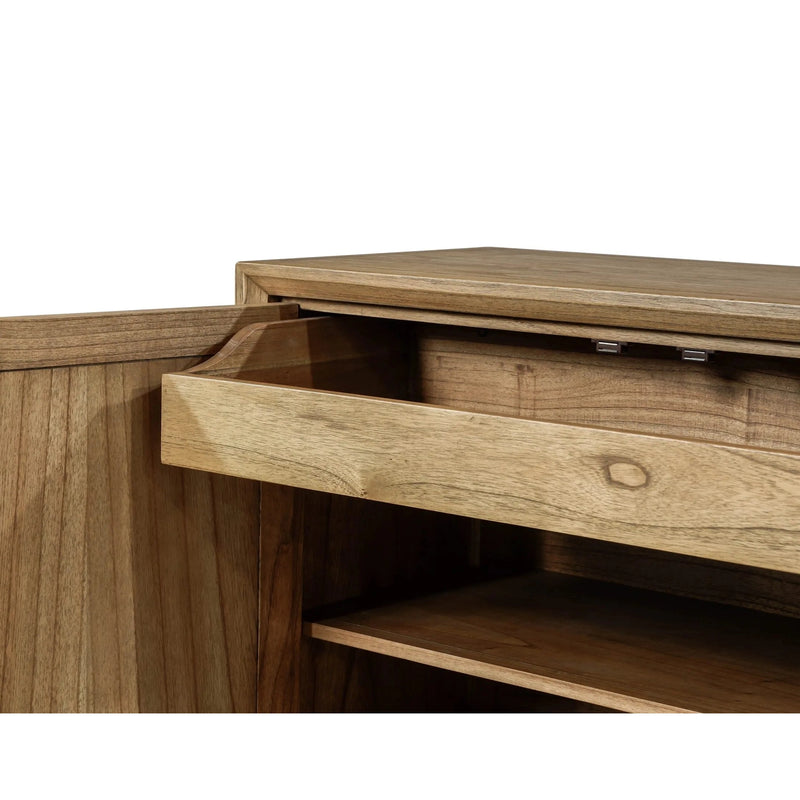 A close-up of the Solstice Large Sideboard, a mid-century modern cabinet in natural solid wood, shows one door open and a drawer partially pulled out to reveal its interior shelves and striking grain patterns.