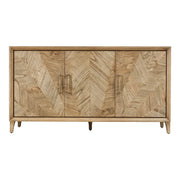 The Solstice Large Sideboard features three doors with a striking chevron pattern, light wood finish, slim metal handles, and stands on short angled legs for a mid-century modern look.