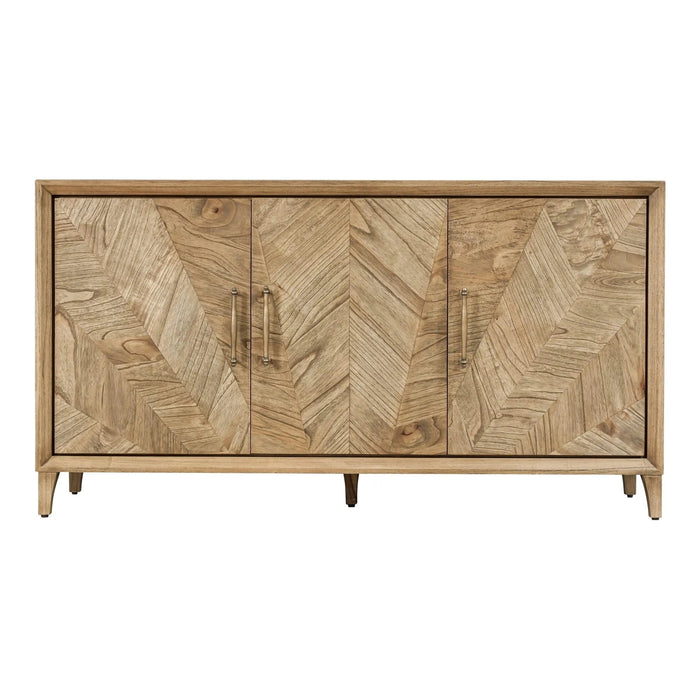 The Solstice Large Sideboard features three doors with a striking chevron pattern, light wood finish, slim metal handles, and stands on short angled legs for a mid-century modern look.