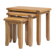 The Saoirse Nest Of Tables includes three premium oak tables with rectangular tops and sturdy legs. Each table fits neatly under the other, highlighting classic solid oak design and practical elegance for any space.