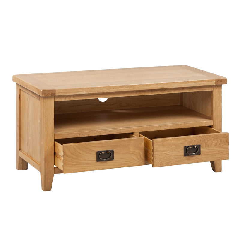 The Saoirse TV Unit is a handmade solid oak stand with an open shelf, two lower drawers with metal handles, shown against a plain white background.