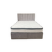 The Bella Ottoman Bed features a modern gray upholstered headboard and base, paired with a white quilted mattress, displayed against a white background.