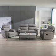 Modern living room featuring the Vera Recliner Sofa, two matching recliners, a rectangular coffee table, rug, built-in shelves, large wall art, and light wood flooring—an ideal setup for comfort and style.