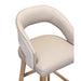 The Willow Dining Chair features a modern design with a light beige padded seat, curved backrest, textured outer fabric, and wooden legs.