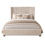 Kildare Storage Bedframe with a tall, vertically channeled headboard, made up with pillows and a knit throw blanket.