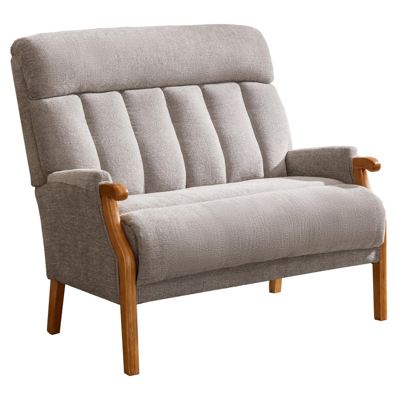 A modern armchair with simple lines on the backrest and light oak wooden legs, upholstered in a grey fabric.