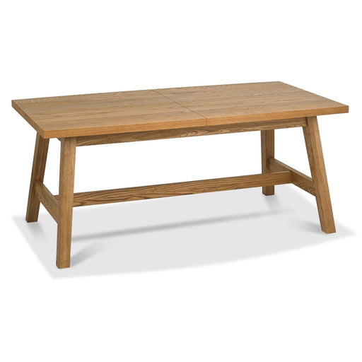 The Camden Dining Table features a solid wooden frame, sturdy legs, horizontal support bar, center seam, and a light brown finish. Shown against a white background.