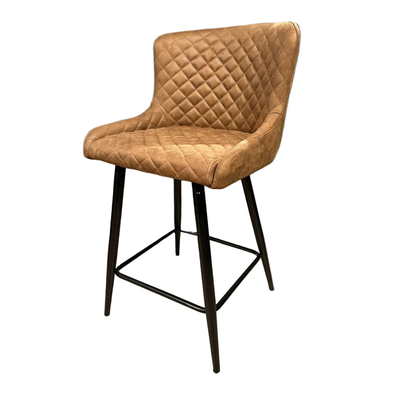The Diamond Counter Stool features modern brown PU leather with quilted diamond stitching, a light brown cushioned seat and backrest, and four slender black metal legs with a footrest—ideal for any kitchen island.