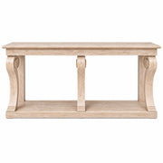 The Montclair Console Table showcases a rectangular light wood top, elegant curved side supports, a central vertical support, and an open lower shelf. Finished in a rustic, distressed style, this table brings timeless charm to any room.
