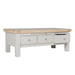 Rectangular table with a natural wood top and a painted gray base featuring three storage drawers, one of which is open.