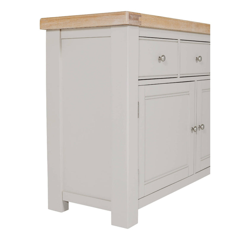 The Doune Sideboard is shown from an angled side view against a white background, featuring a light gray finish, oak veneer-style wooden countertop, two drawers with round metal knobs, and cabinet doors below.
