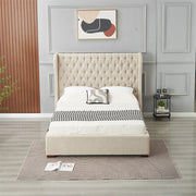 A modern bedroom featuring the Vienna Bedframe with a beige tufted winged headboard, white and gray bedding, a side table with a clock and plant, abstract wall art, and a gray patterned rug on light wood flooring.