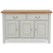 A large sideboard with a soft grey base and a solid oak top, featuring three drawers and two doors.