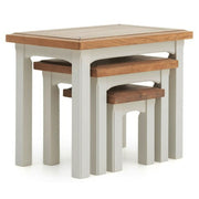 Two-tone wood accent tables with light gray legs and a warm, contrasting brown wood surface, set of three.