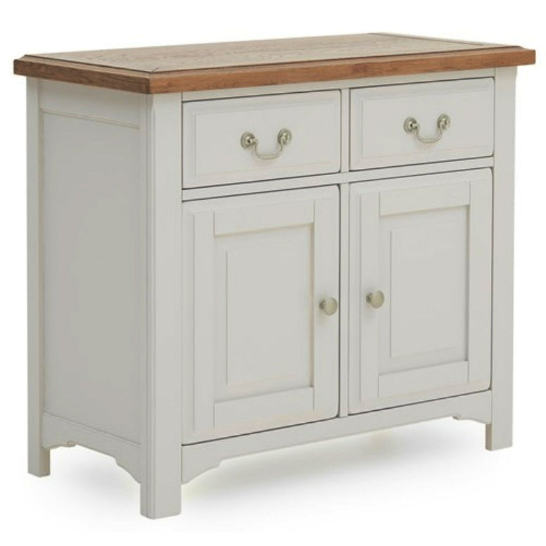 The Eden Small Sideboard features a white wooden frame, solid oak top, two drawers with metal handles, and two cabinet doors with round knobs, all supported by four sturdy legs.