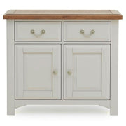 The Eden Small Sideboard is a white wooden cabinet with a solid oak top, two drawers with metal handles, and two cabinet doors with round knobs—a beautiful handcrafted addition to any home.