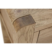 Close-up of the Edson Nest Of Tables corner, showcasing detailed oak wood grain and precise joinery with a smooth, natural finish.