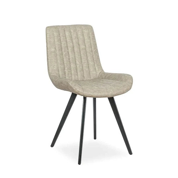 The George dining chair by vendor-unknown features a modern industrial design with a light beige, vertically-stitched upholstered seat and backrest, and four angled black metal legs, displayed against a white background.