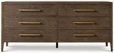 The Hampshire Wide Chest is a modern wooden dresser with a dark wood finish, six drawers featuring long slim gold handles, and short angled legs, perfect for adding style and storage to your bedroom.