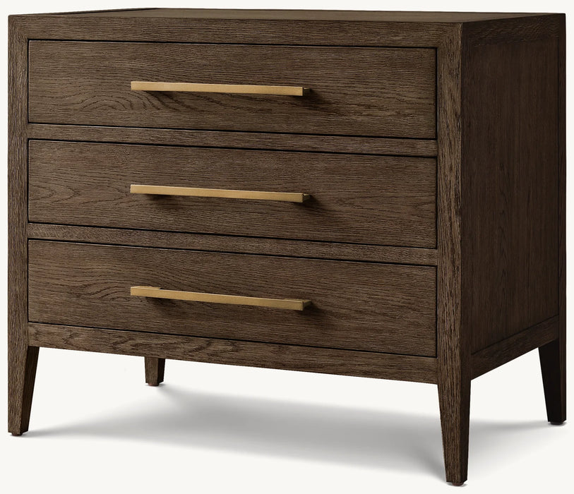 The Hampshire Locker is a modern dark wood dresser with three drawers featuring gold accents, long horizontal handles, and simple tapered legs, giving it a timeless and sophisticated style.