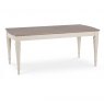 The Montreux Range 180cm-225cm Set is a rectangular dining table with a light brown wooden top and white tapered legs. Shown against a plain white background, it pairs well with wooden and leather chairs for a stylish dining experience.