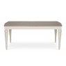 The Montreux Range 180cm-225cm Set is a rectangular, extendable dining table with a light brown top and white turned legs. Shown against a white background, it pairs well with wooden or leather chairs for an inviting dining space.