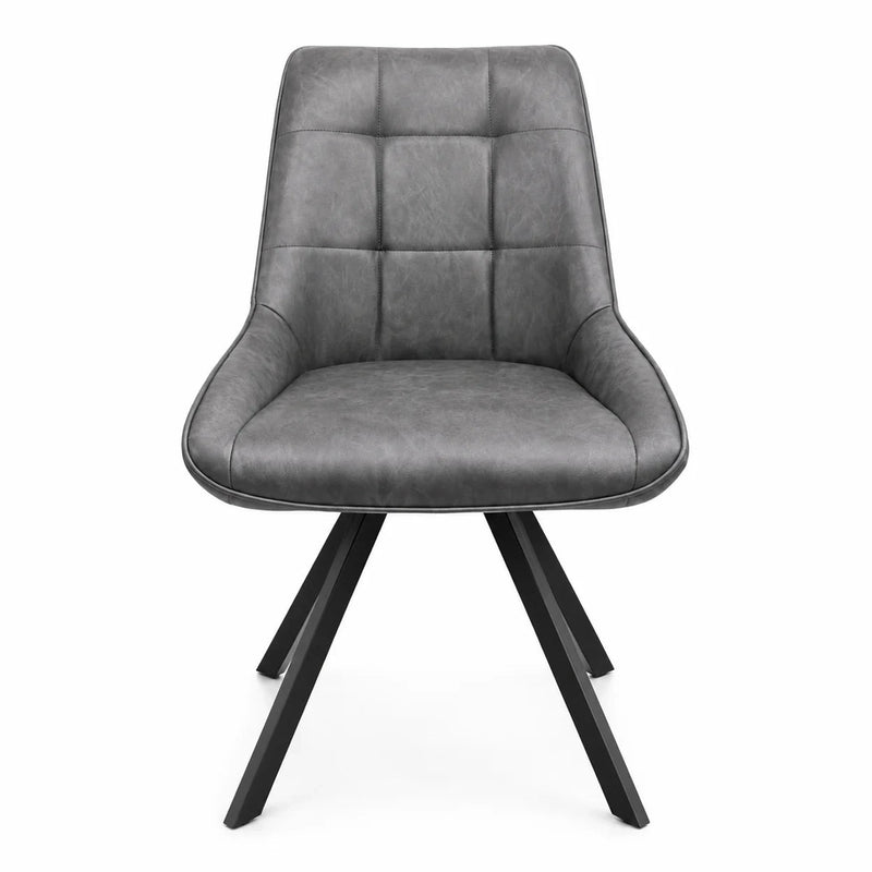 The Pedro Dining Chair is a modern gray upholstered dining chair with a cushioned seat and backrest, featuring quilted square stitching and four angled black metal legs. Photographed from the front against a white background, this elegant chair combines comfort and contemporary style for any space.