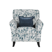 The Pippa Accent Chair features white and dark blue upholstery with a leaf pattern and includes a square dark blue throw pillow centered on the backrest.