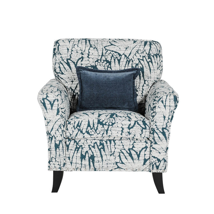 The Pippa Accent Chair features white and dark blue upholstery with a leaf pattern and includes a square dark blue throw pillow centered on the backrest.