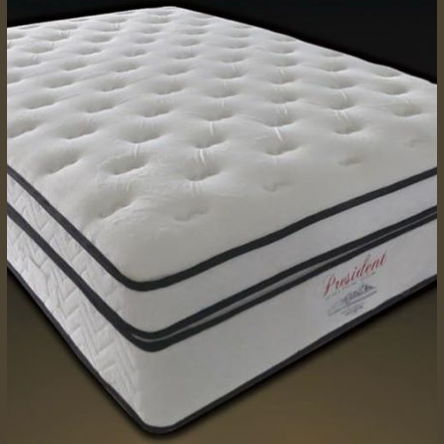 A white, pillowtop mattress with the brand name 'President' visible on the side.