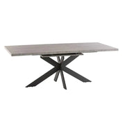 The Rimini Dining Table features a modern rectangular design with a grey stone-coloured melamine top and angled, intersecting black metal legs.