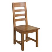 The Saoirse Dining Chair is crafted from solid oak, featuring a tall slatted backrest, flat seat, straight legs, and a natural wood finish in a simple, sturdy design.