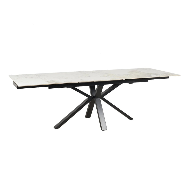 The Sorrento Dining Table features a white marble top and black angular metal legs in a striking starburst pattern.