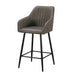The Enzo Counter Stool features a grey faux leather seat with vertical stitching, low armrests, black metal legs with footrests, and cushioned seating for added comfort.